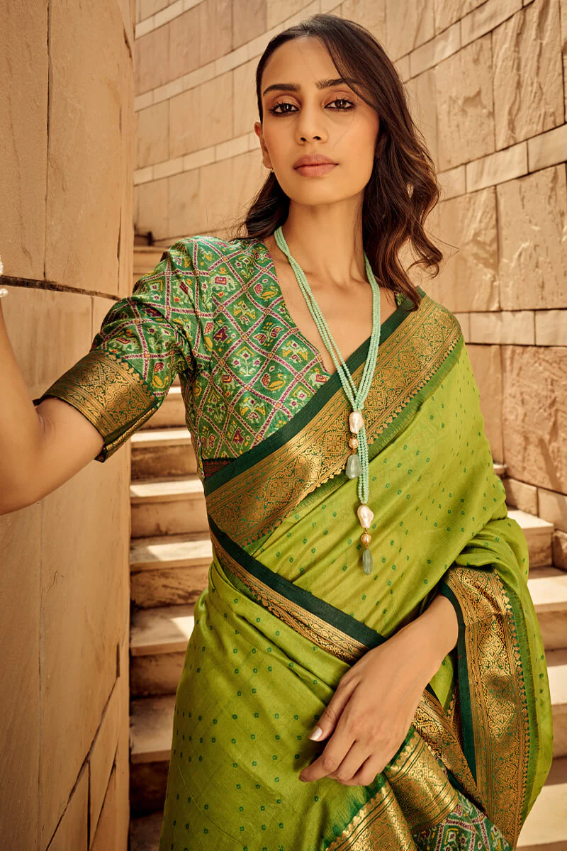 Ornate Green Patola Silk Saree with Tremendous Blouse Piece - Image 2